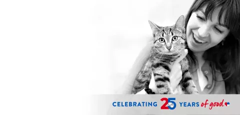 woman holding a cat and text:"Celebrating 30 years of good"